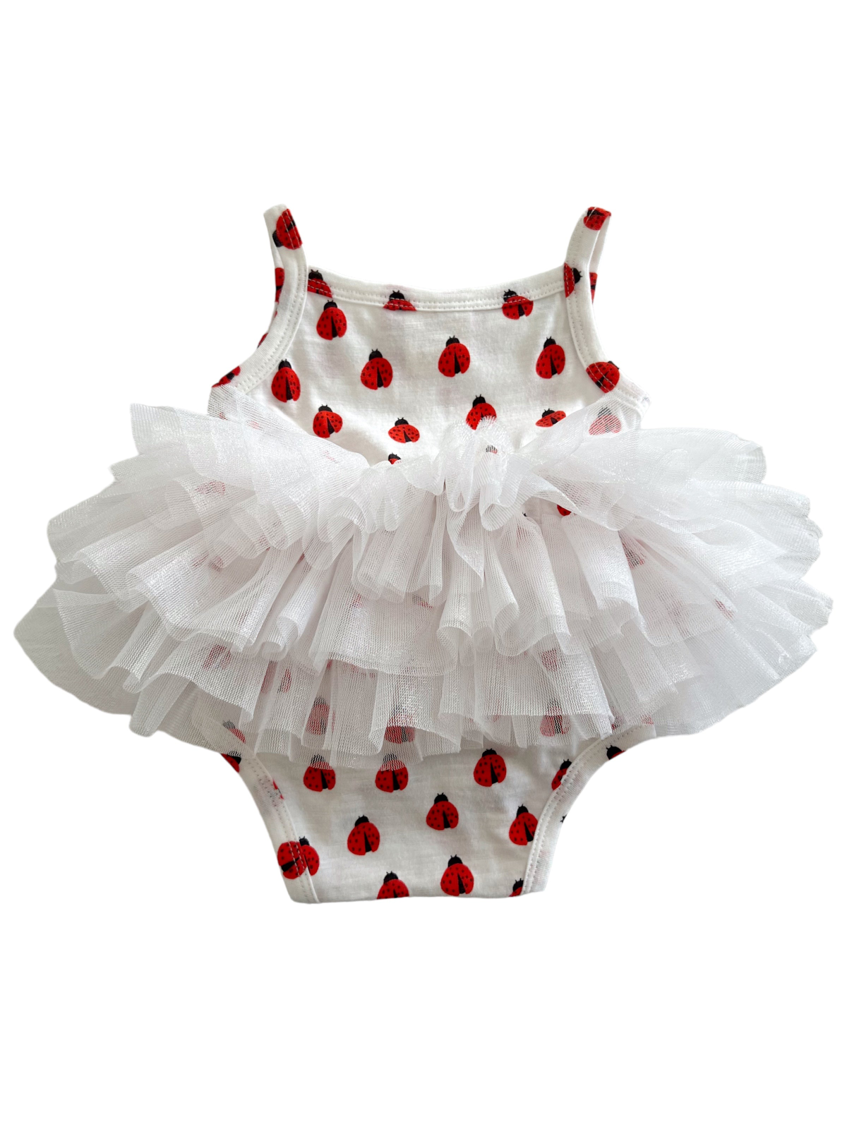 White toddler swimsuit with red ladybug print and a fluffy white tulle skirt. Perfect for summer fun.