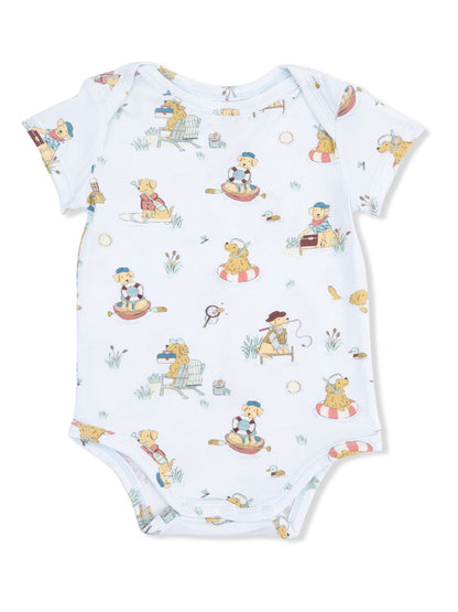 Light blue baby onesie with a playful dog pattern showcasing dogs in various outdoor activities.