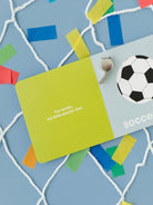 Open card displaying a soccer ball and text "For Annie, my little soccer star" on a colorful, playful background.