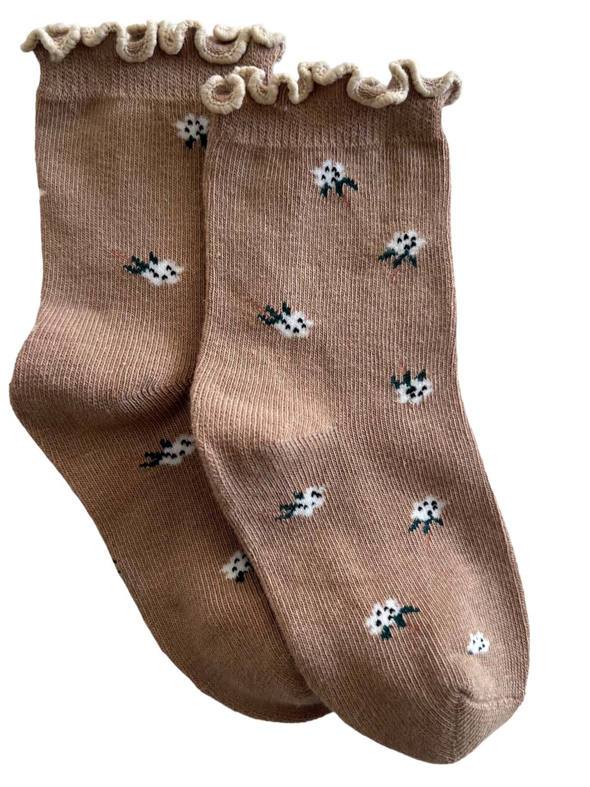 Brown socks with a ruffled edge and white floral patterns, designed for a stylish and comfortable look.