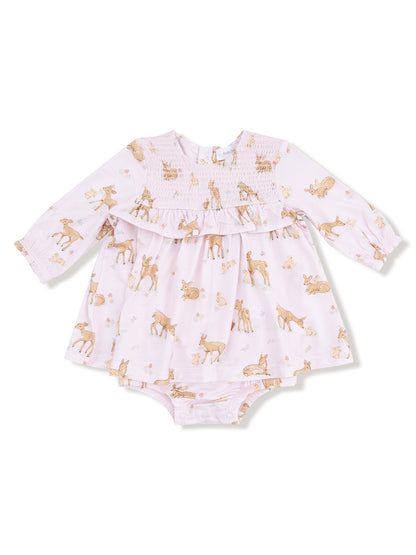 Pink dress with animal prints, featuring long sleeves and a smocked bodice, suitable for infants.