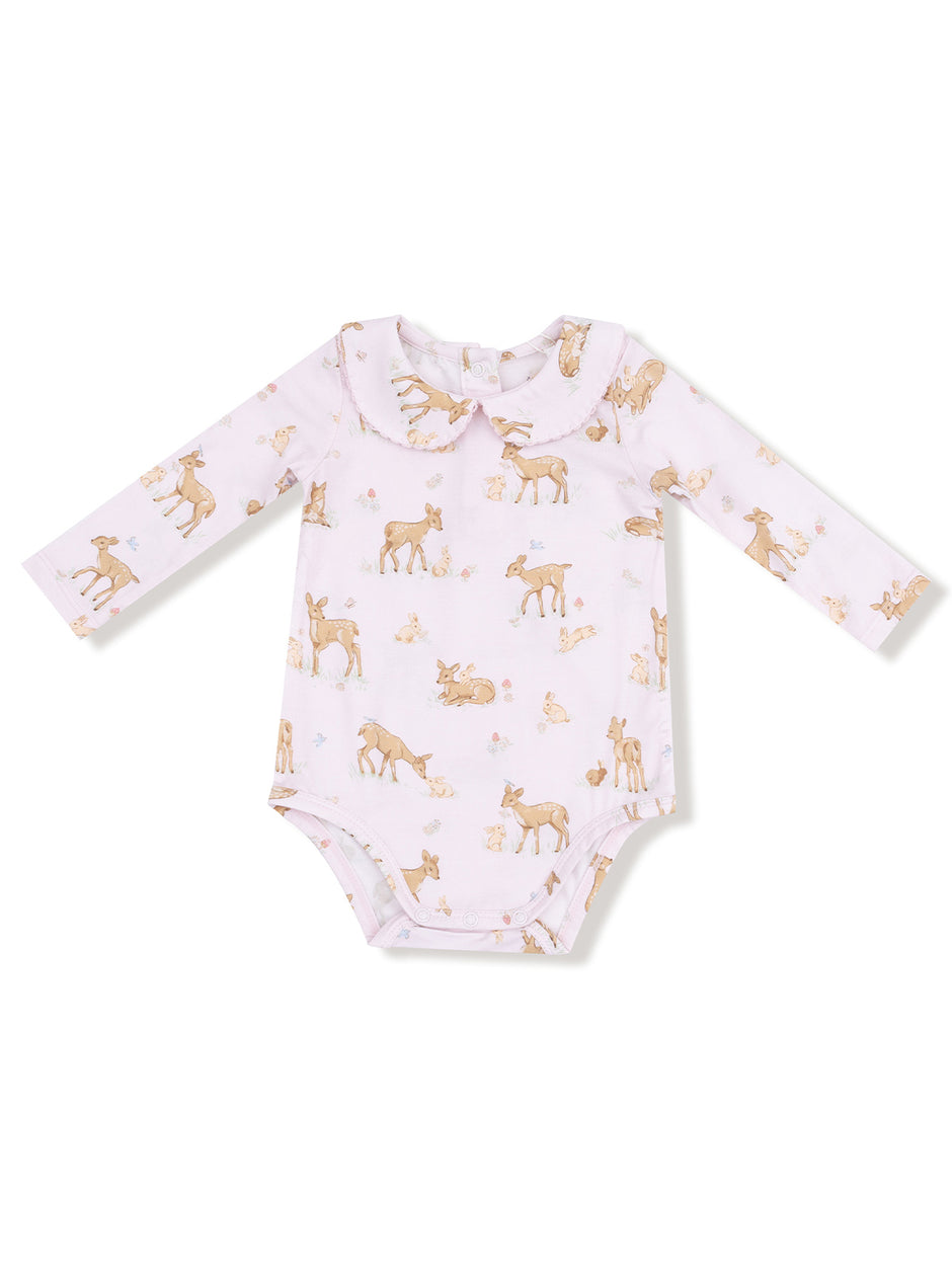 Baby onesie with a light pink background and cute animal prints, featuring deer and other woodland creatures.