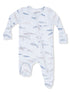 Light blue baby onesie with whale patterns, featuring a front zipper and footed design. Ideal for comfort and style.