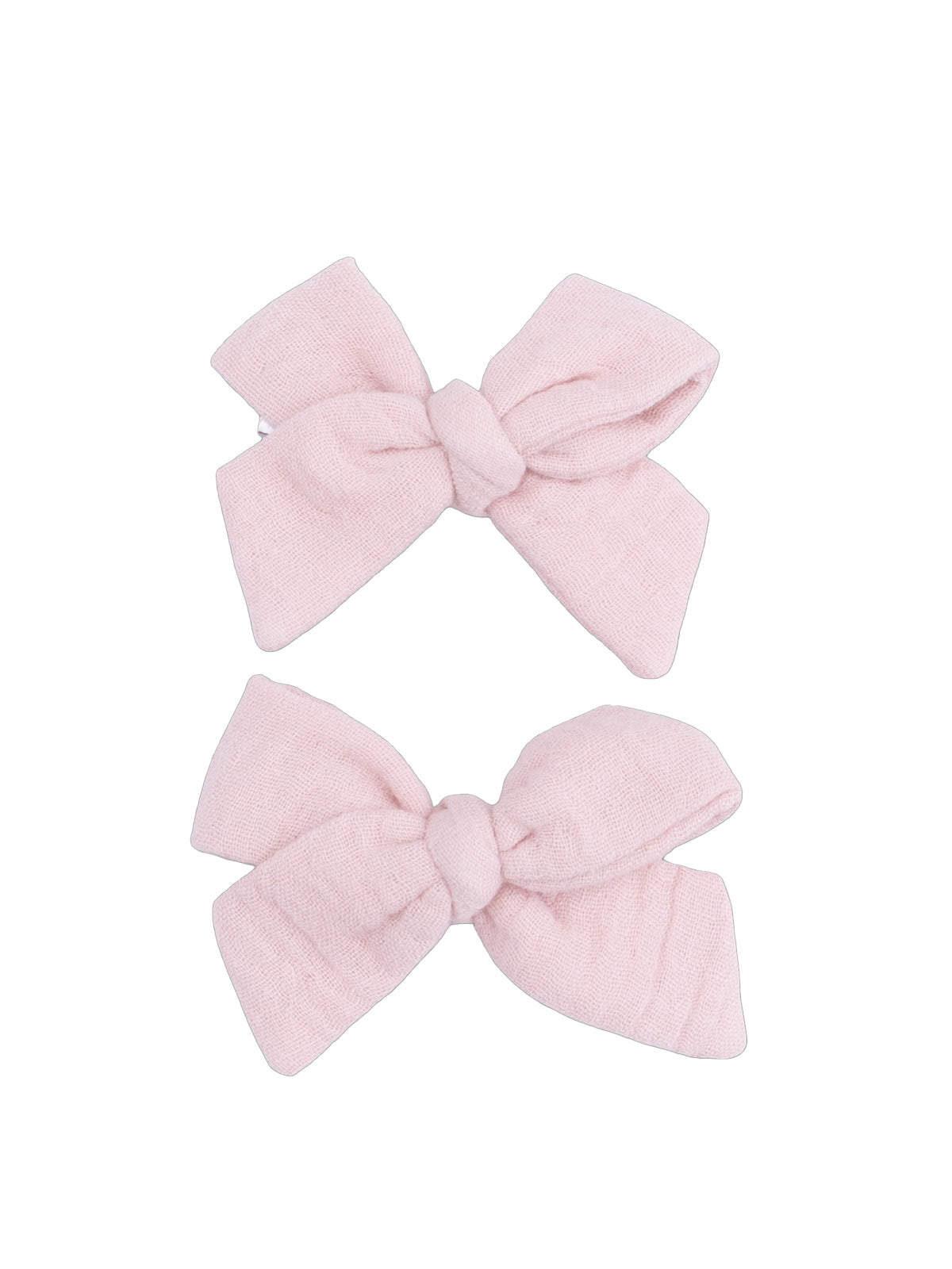 Two pastel pink fabric hair bows arranged neatly.