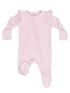 Pink infant romper with ruffle details and a front zipper for easy dressing, featuring polka-dot foot grips.