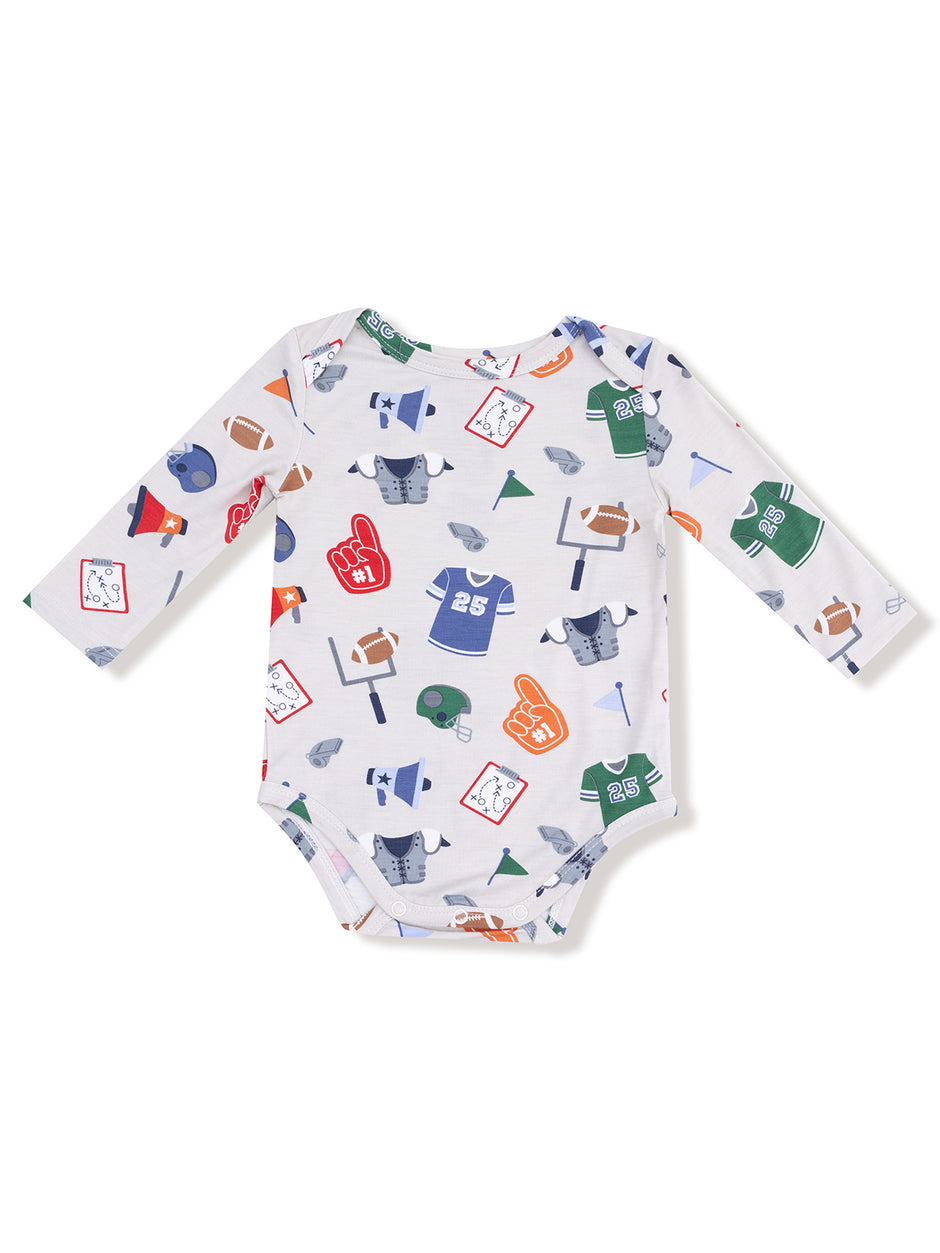 Baby onesie with colorful sports-themed prints, including jerseys, helmets, and sporting equipment.