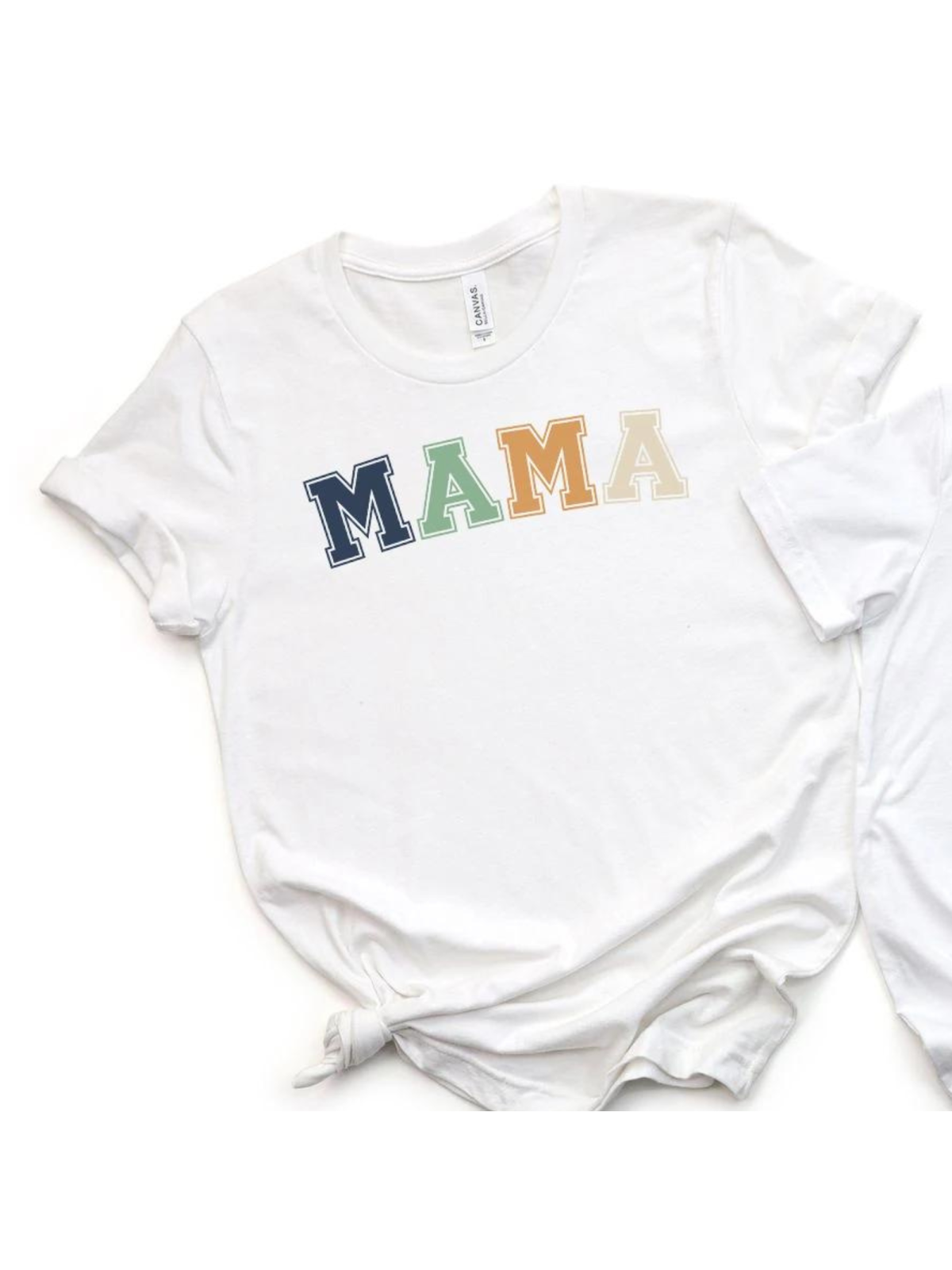 White t-shirt featuring colorful "MAMA" text in bold letters. Perfect for casual wear.