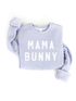 Light purple sweatshirt with bold white text reading "MAMA BUNNY." Ideal for casual wear or seasonal events.