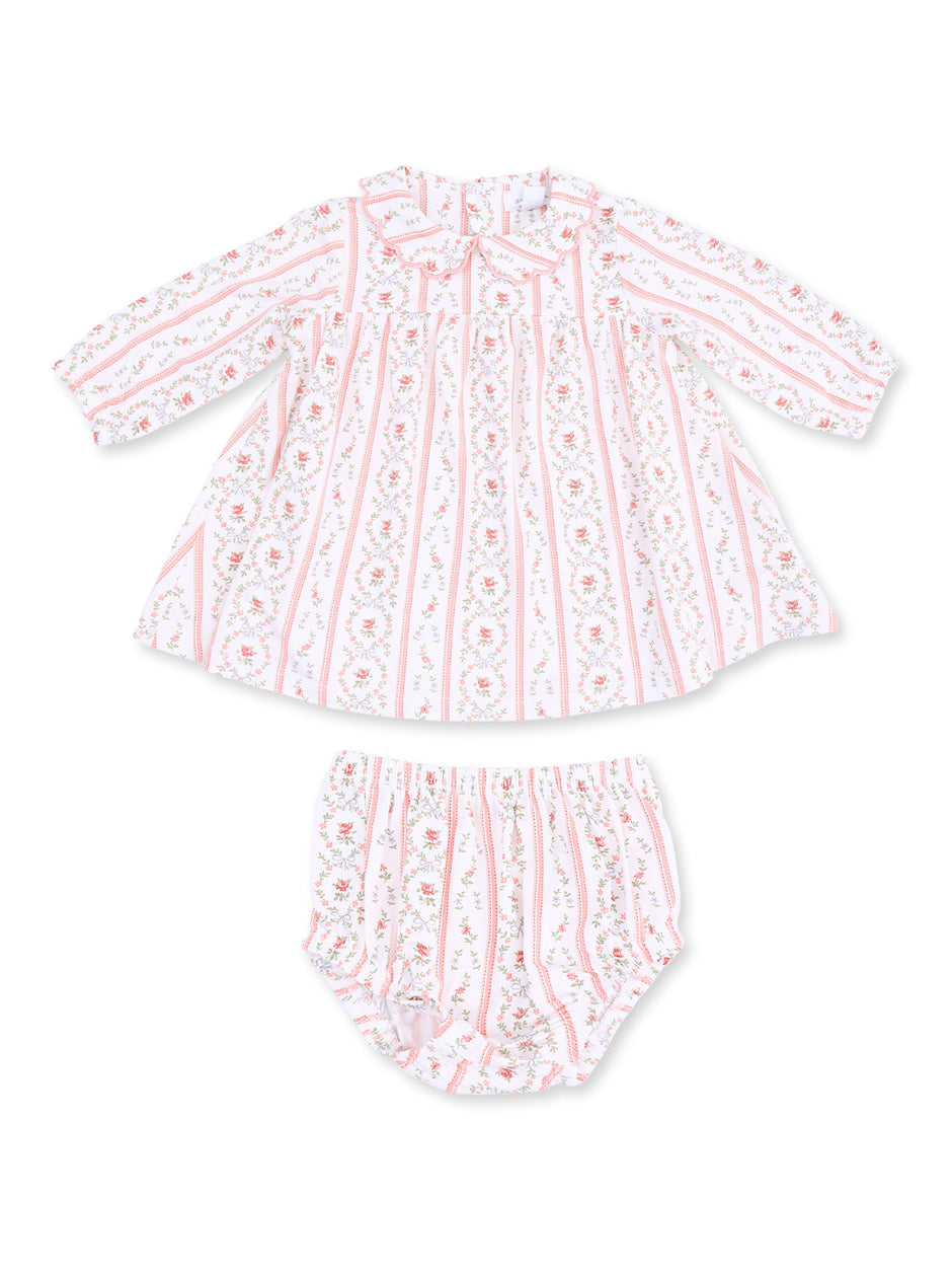 Pink and white floral dress with matching bloomers for infants, featuring a playful, vintage-inspired design.