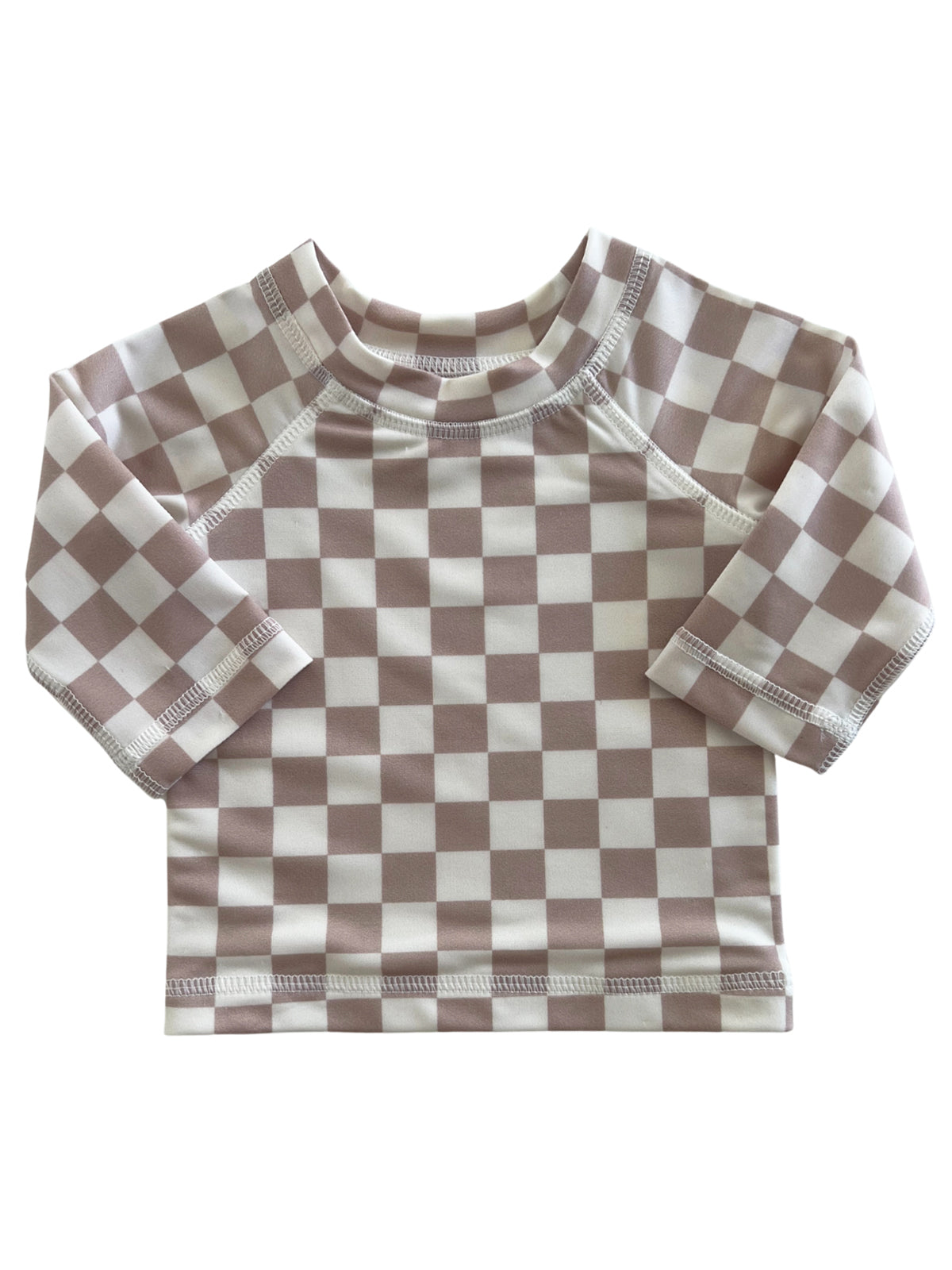 Brown and white checkered long-sleeve shirt for children, featuring a soft fabric and rounded neckline.