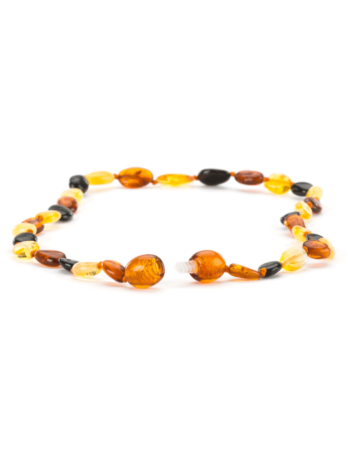 Amber and black bead necklace on a white background, showcasing a mix of warm colors and smooth textures.