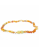 Amber bead necklace with varied shades of yellow and orange arranged in a circular pattern.