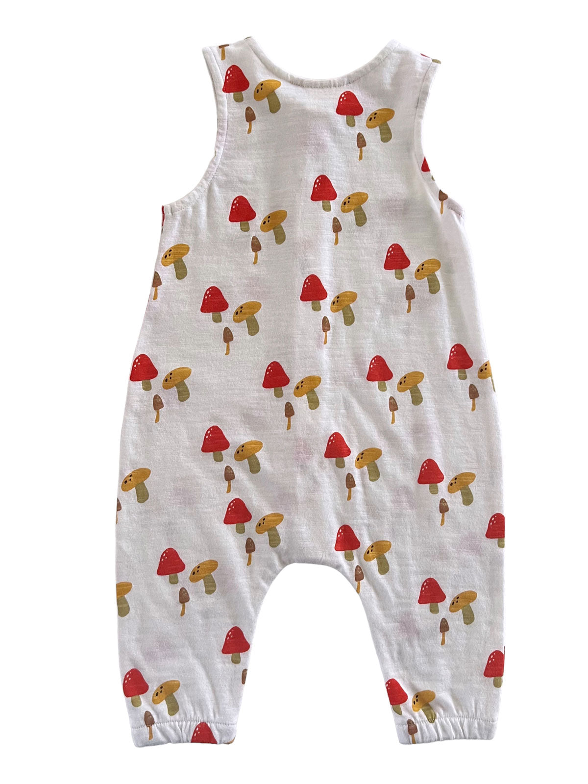 Toddler romper featuring a playful mushroom print in red and brown on a white background.