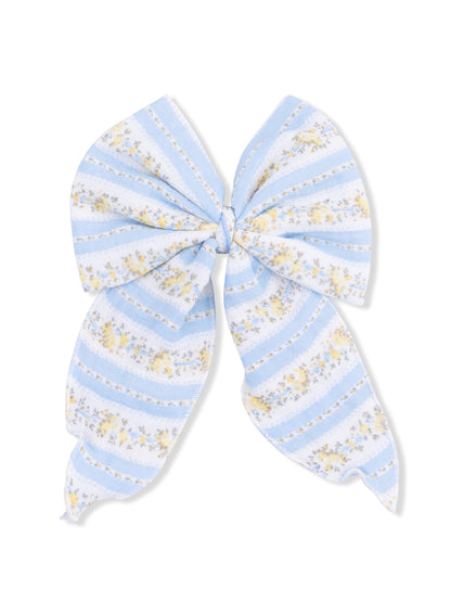 Light blue fabric bow with floral patterns and stripes, ideal for hair accessories or embellishments.