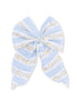 Light blue fabric bow with floral patterns and stripes, ideal for hair accessories or embellishments.