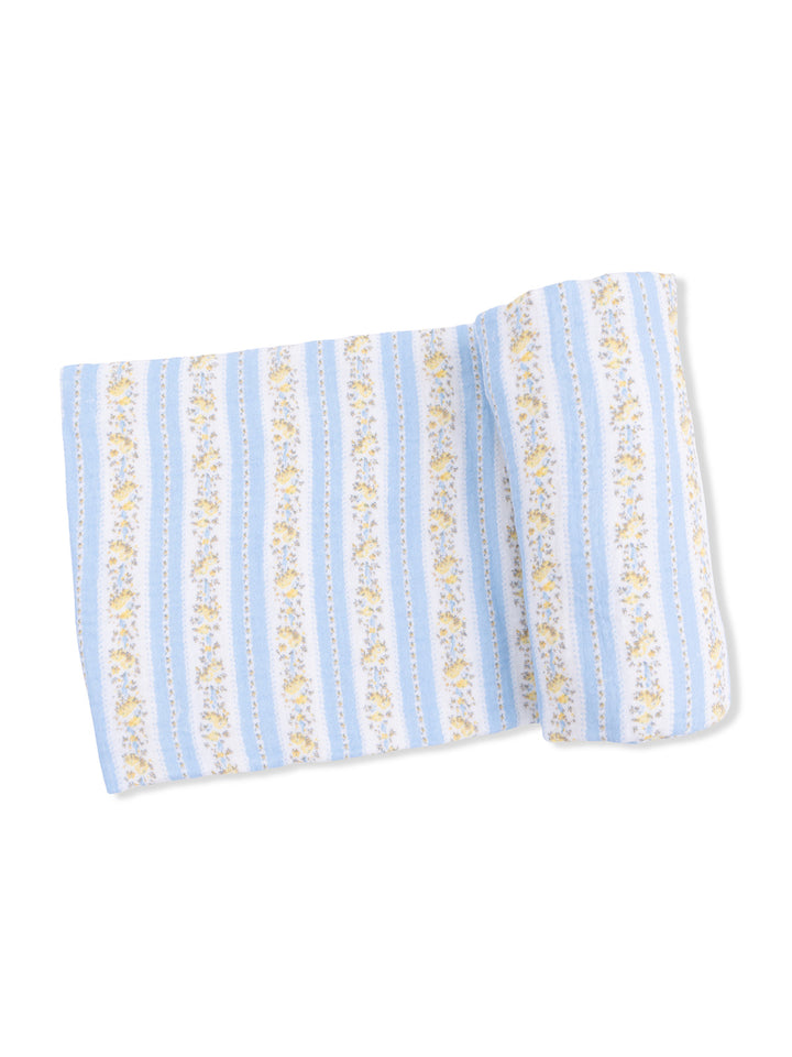 Light blue fabric with floral and striped patterns, folded and on a white background.