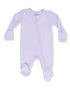 Light purple baby onesie with long sleeves and a front zipper, featuring polka-dotted foot grips.