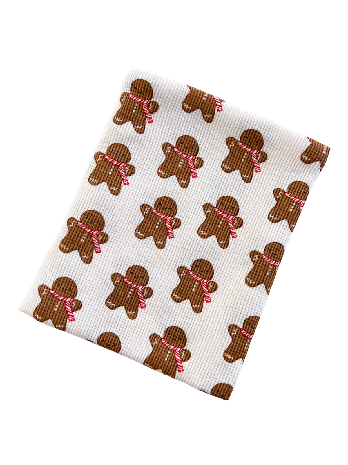 Gingerbread man patterned dishcloth featuring brown figures with red ribbons on a white background.