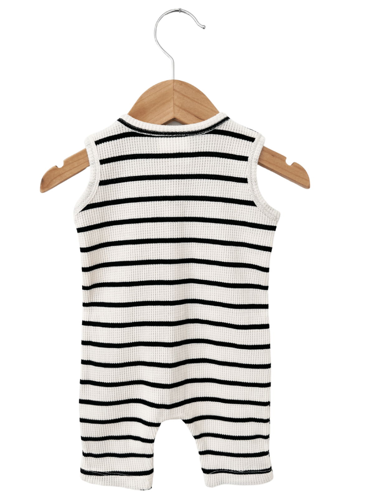 Black and white striped sleeveless baby romper hanging on a wooden hanger.