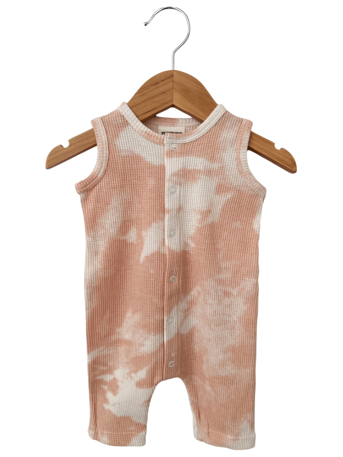 Peach tie-dye infant onesie hanging on a wooden hanger against a white background.
