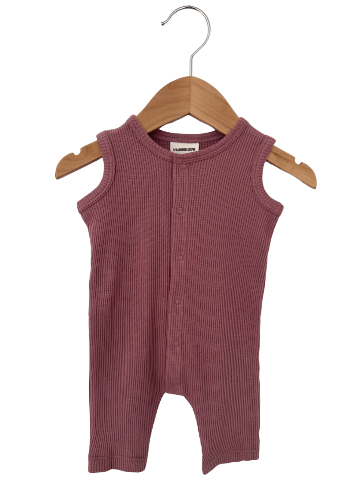 Purple ribbed infant romper on a wooden hanger, featuring buttons down the front and sleeveless design.
