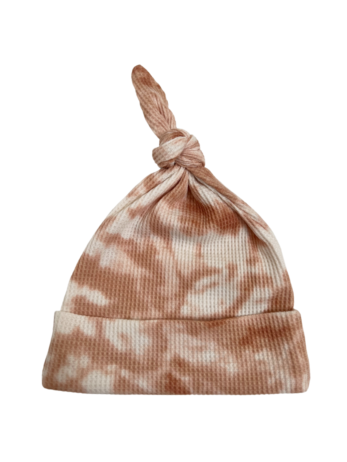 Knitted tie-top beanie hat in peach and white tie-dye pattern on a white background.