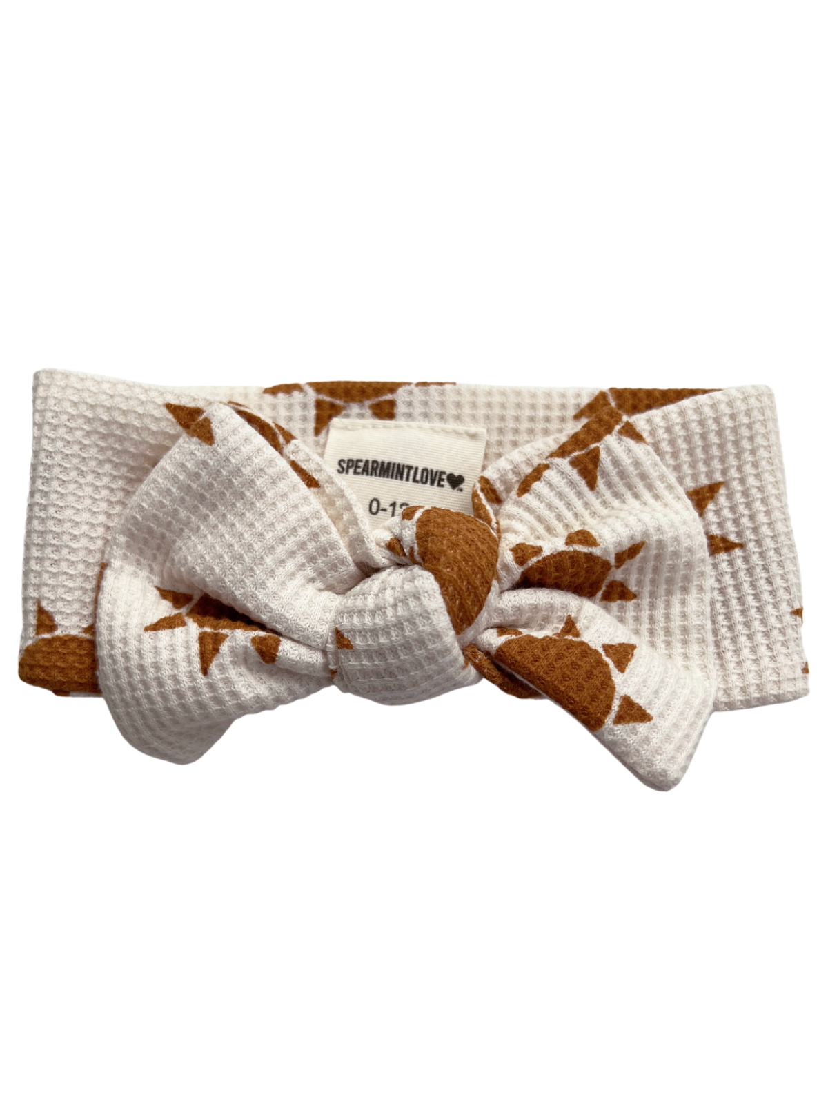 White headband with a brown sun print and a bow, labeled "SPEARMINTLOVE." Suitable for infants 0-12 months.