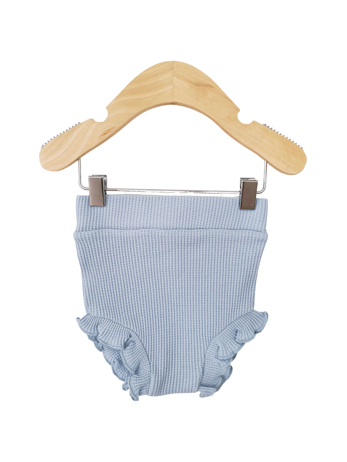 Light blue children's swim bottoms with ruffled edges, hanging on a wooden hanger.