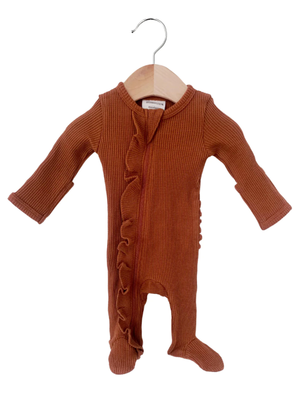 Brown ribbed baby onesie with ruffles, hanging on a wooden hanger against a white background.