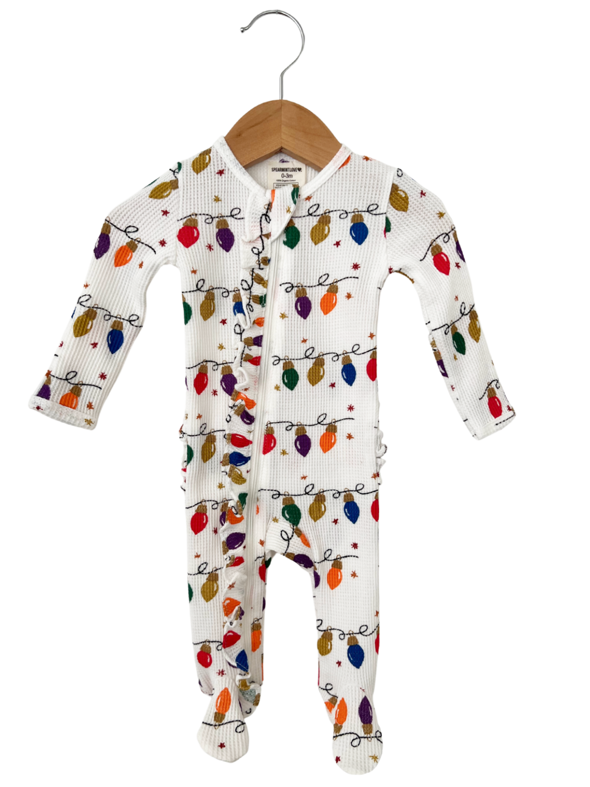 White infant onesie with colorful holiday lights pattern, wooden hanger, and zipper front closure.