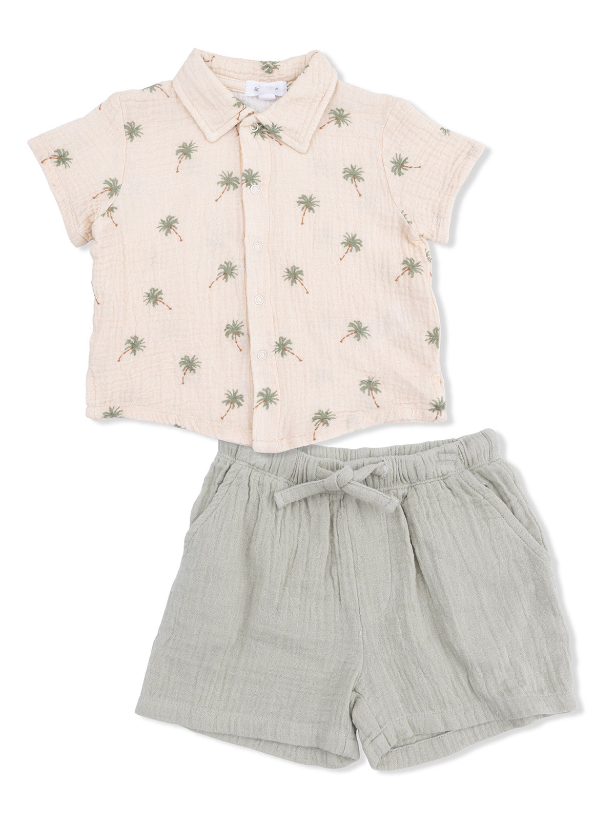 Light pink short-sleeve shirt with palm tree print paired with gray shorts with drawstring.