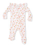 Light pink infant onesie with peach and bow patterns, featuring ruffled shoulders and footed design.