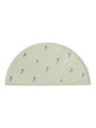 Silicone placemat in soft green with playful blue dog illustrations. Ideal for mealtimes and easy to clean.