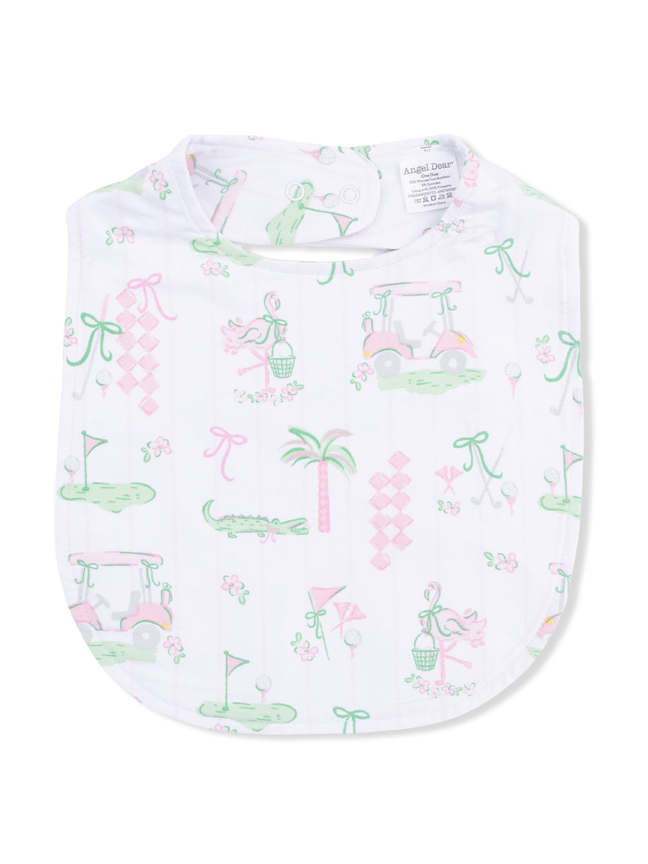 White bib featuring a playful print of golf-themed icons, flowers, and palm trees in pastel colors.
