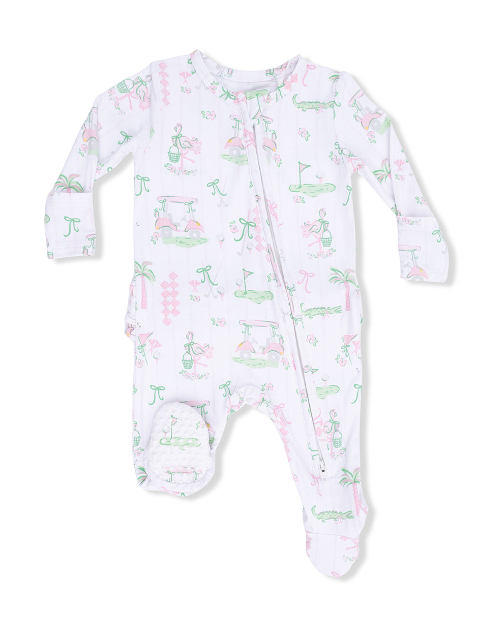 White baby onesie with playful pink and green patterns, featuring golf themes and tropical elements.