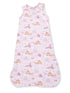 Pink baby sleep sack with whimsical princess-themed print, featuring castles, unicorns, and balloons.