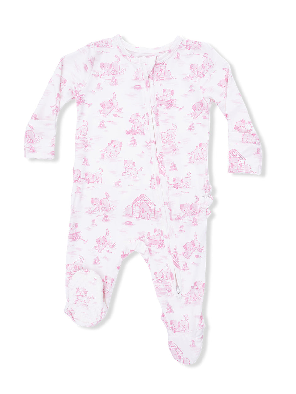 Pink infant onesie with playful puppy designs and a front zipper closure. Ideal for sleep and play.