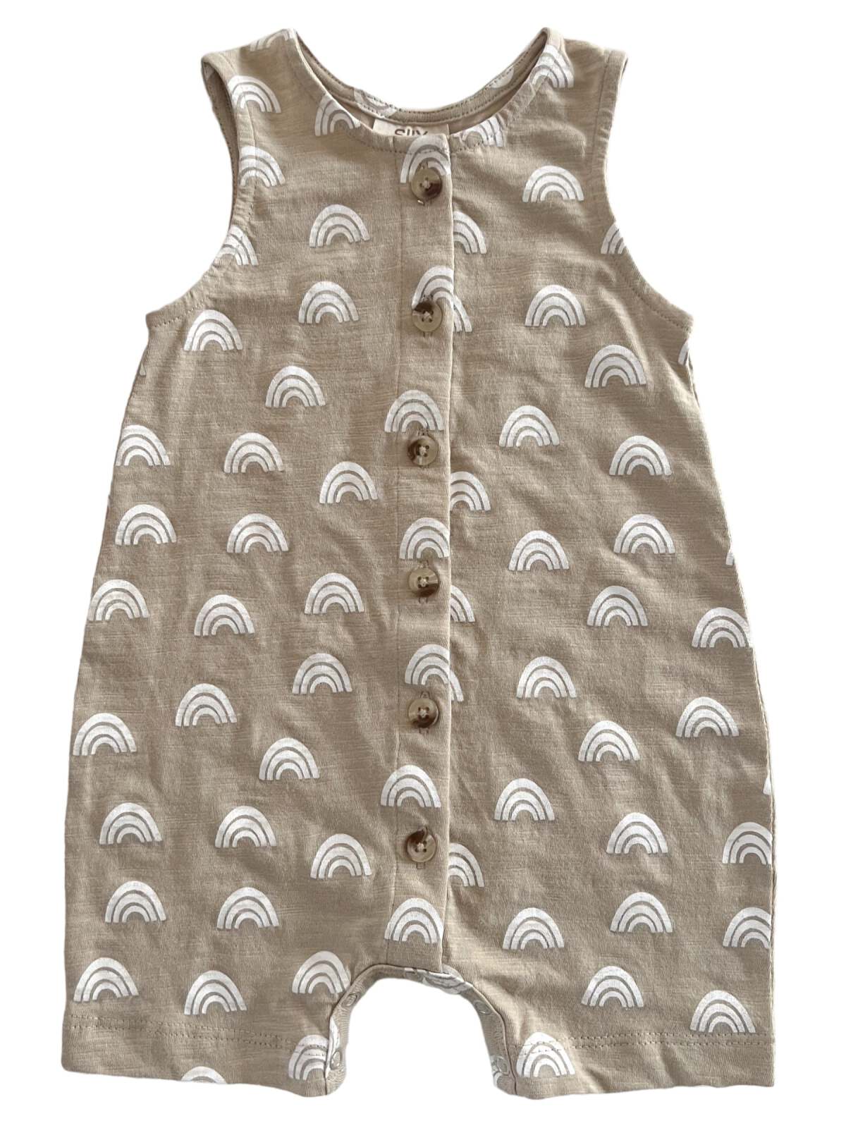 Tan baby romper with white rainbow patterns and five buttons down the front.