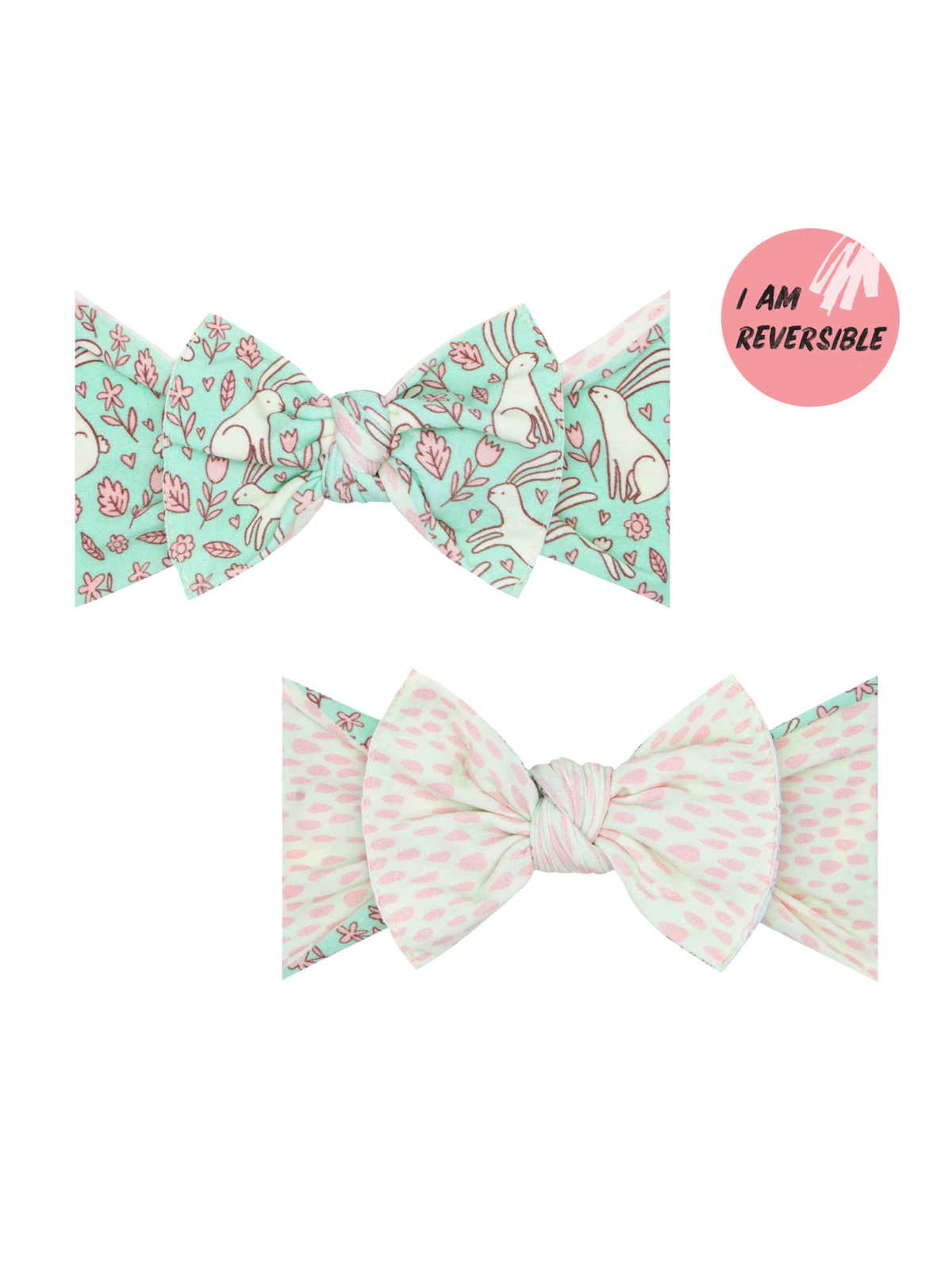 Reversible bow hair accessory featuring floral and polka dot patterns in mint and pink colors.