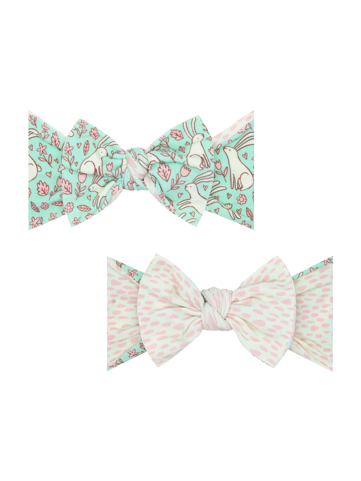 Two patterned bows featuring floral and animal designs on a mint background. Perfect for children’s accessories.