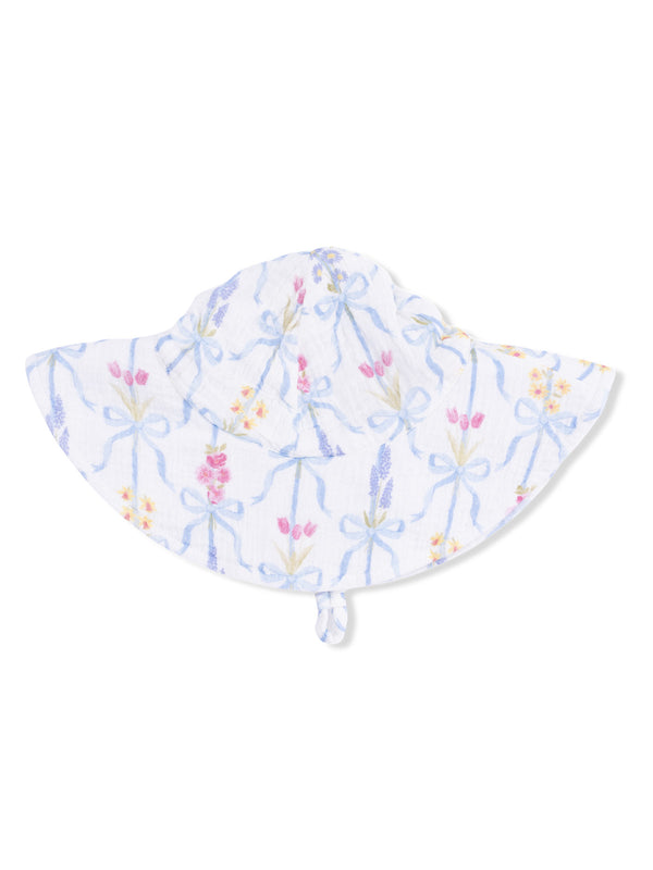 White sun hat with floral pattern and blue ribbons, designed for sun protection and stylish outdoor wear.