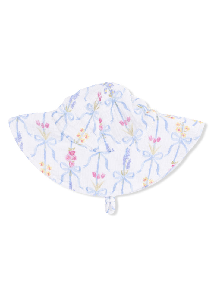 White sun hat with floral pattern and blue ribbons, designed for sun protection and stylish outdoor wear.