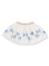 White tulle skirt adorned with blue sequined bows and a pink waistband. Ideal for playful and stylish outfits.