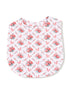 Floral-patterned fabric with red roses and ribbons on a white background, shaped like a top or bib.