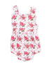 Floral baby romper in white with pink roses and green leaves, featuring wide straps and a gathered waistband.