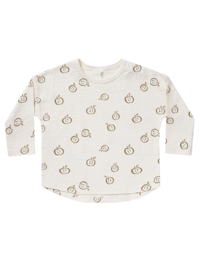 Light cream long-sleeve shirt with a playful apple print in brown and green tones.