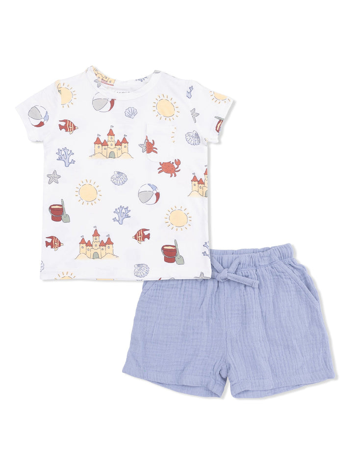 Children's beach-themed shirt with castle print and light blue shorts, ideal for summer wear.
