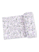 Floral-patterned bedding set featuring lavender and gray flowers on a white background.