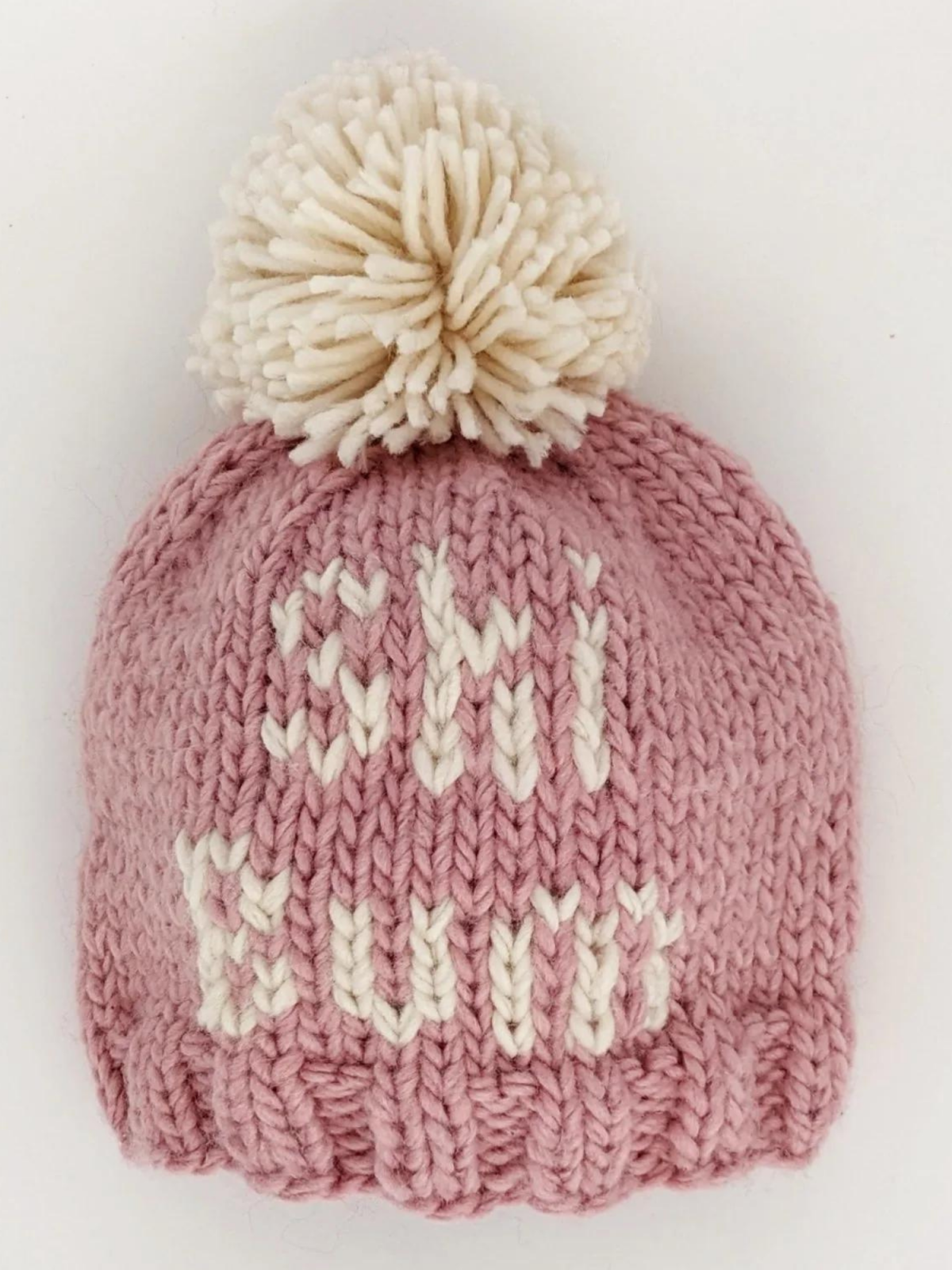 Knitted pink winter beanie with a pom-pom and "CHI WIT" text in white.