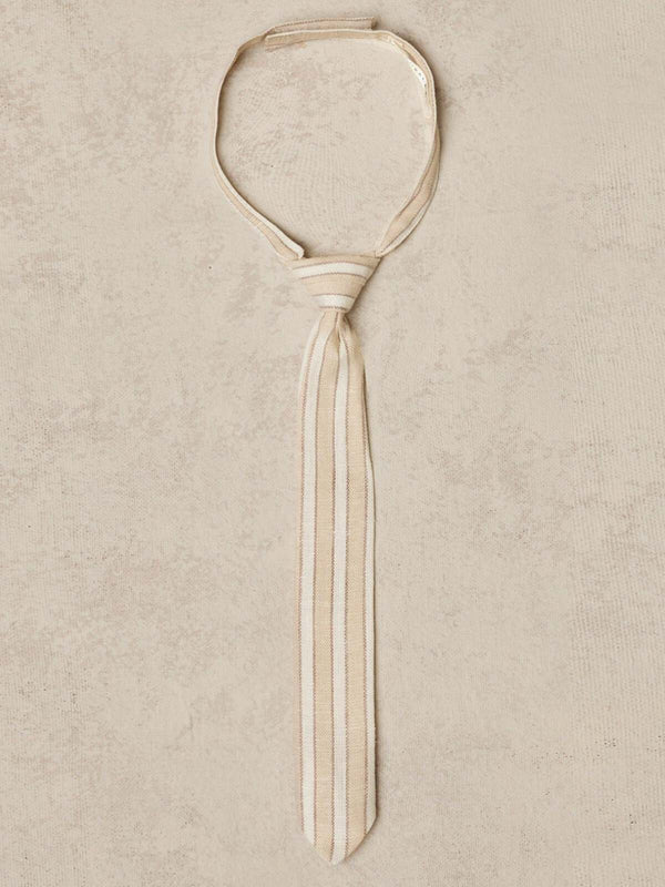 Beige striped tie displayed on a textured background.